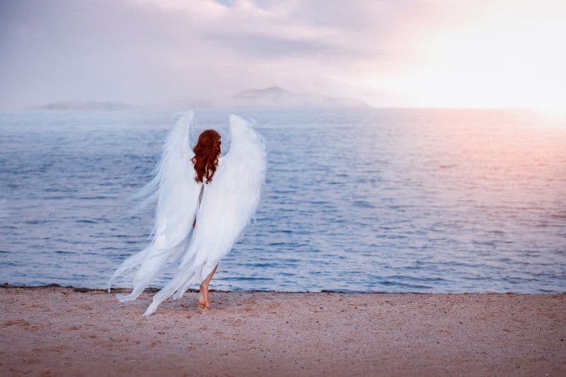 angel walking on the beach